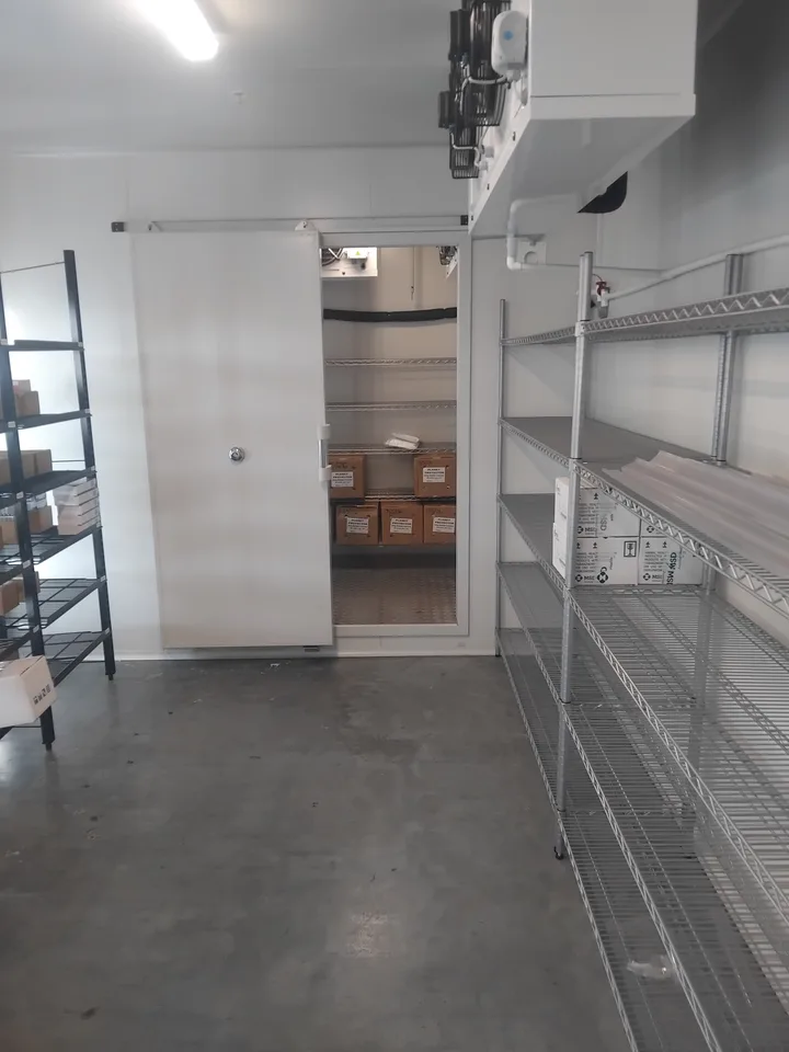 Close view of the evaporator equipment installed in the cold storage room
